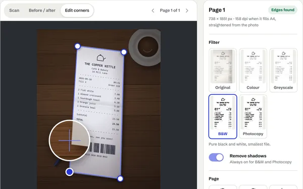 DocScan’s corner editor on the receipt sample: the receipt outlined in blue on a wooden desk, with a magnifier over one corner